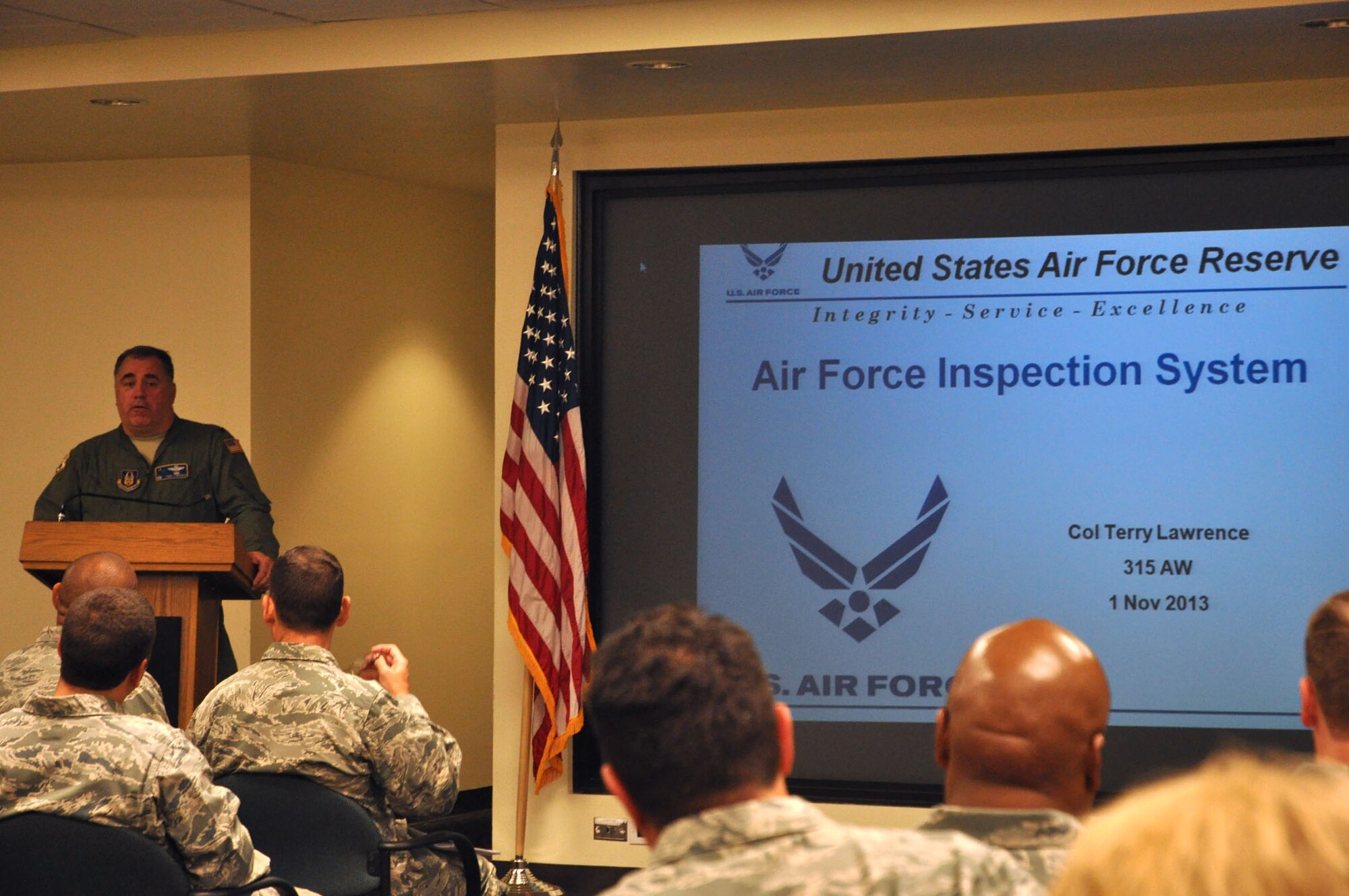 Col. Terry Lawrence, special assistant to the 315th Airlift Wing commander, conducts a briefing on the upcoming Uniform Effectiveness Inspection during Unit Assembly Training Saturday, Nov. 2, 2013.