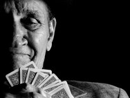 William “Pops” Diaz, a "70-something-year-old" card shark and U. S. Army retiree, plays Texas Hold’em Poker Mondays and Wednesdays at the bowling alley at Fort Meade Md.  Each time he’d sit to play, he’d be dressed in a suit along with his lucky poker fedora.  It was said he had the best poker face of all of the regular players.  Diaz was a boxing champion for the Army while he was active duty.  (U.S. Air Force photo/Tech. Sgt. Jasmin Taylor)  
