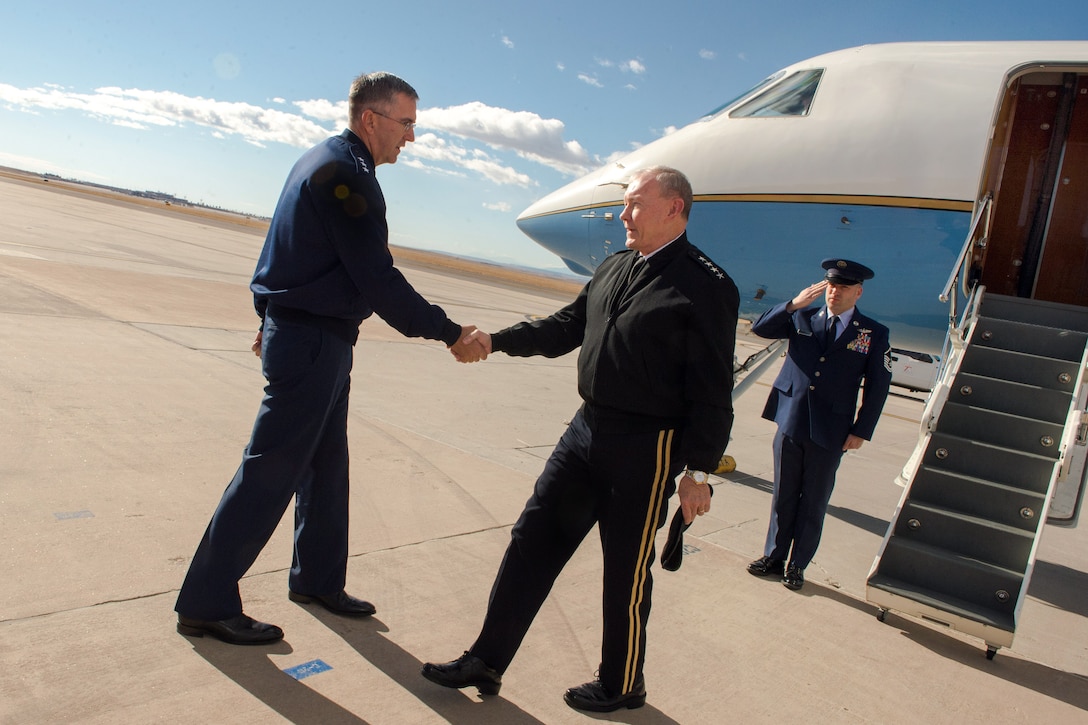 Air Force Lt. Gen. John E. Hyten, left, greets Army Gen. Martin E. Dempsey, chairman of the Joint Chiefs of Staff, on Peterson Air Force Base, Colorado Springs, Colo., Nov. 1, 2013. Hyten is vice commander of the Air Force Space Command.