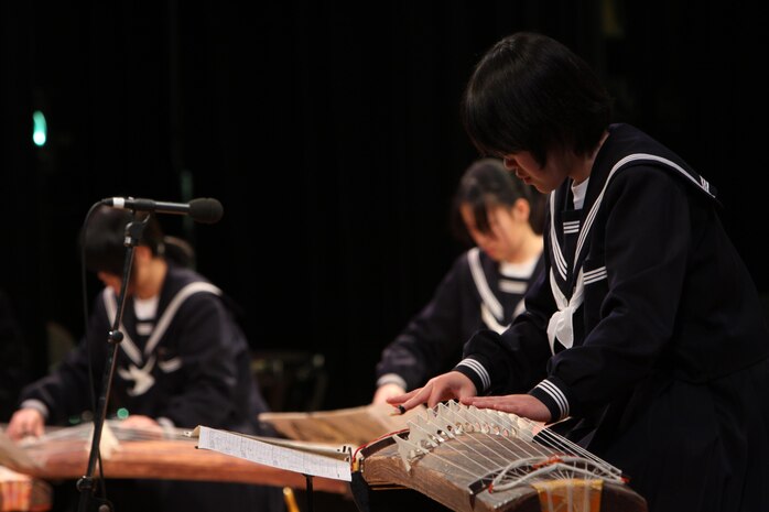 A Japanese student plays a koto during the U.S.-Japan Friendship Concert Feb. 18 at Iwakuni Civic Hall. The Japanese students played songs such as ‘Somebody Somewhere,’ ‘National Emblem March’ and several others.