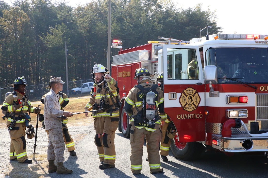 The Quantico Fire Department discussed procedure with Marines at the Ammo Supply Point aboard Marine Corps Base Quantico on Oct. 29, 2013. The fire department and the supply point used the event as training.