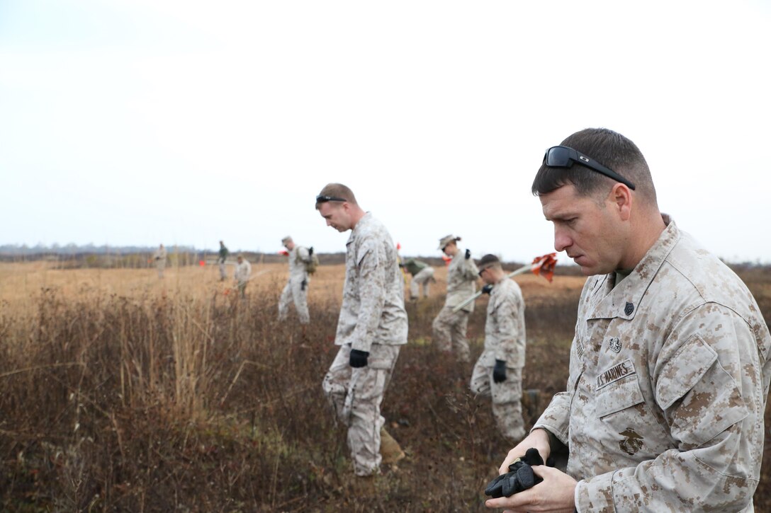 Marines look for unexploded ordnances during a range sweep of Range 7 aboard Marine Corps Base Quantico on Oct. 30, 2013. Marines with Quantico’s Explosive Ordnance Disposal unit conduct range sweeps every few months.