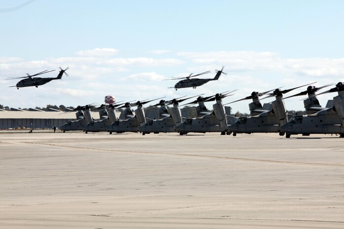 The Marines from Marine Medium Tiltrotor Squadron 266 Reinforced fly their MV-22B Ospreys in formation above Marine Corps Air Station New River during their homecoming ceremony, Nov. 4. Marines from VMM-266 (Rein.) were greeted by a crowd of friends and family who the Marines haven't seen since they departed for the 26th Marine Expeditionary Unit 26, 8 months ago.