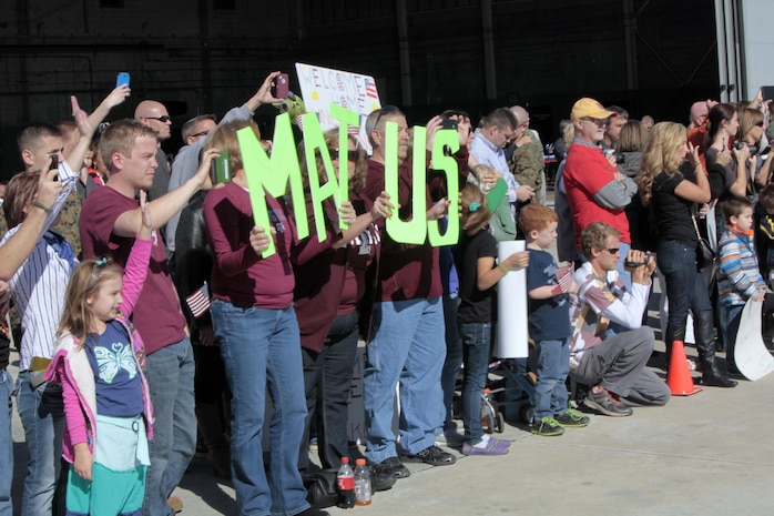 Friends and family of Marines from Marine Medium Tiltrotor Squadron 266 Reinforced eagerly wait for their Marines to arrive at Marine Corps Air Station New River during their homecoming ceremony, Nov. 4. This was the first time the Marines from VMM-266 (Rein.) saw their loved ones since they departed for the 26th Marine Expeditionary Unit 26, 8 months ago.