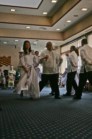 Marine Corps Air Station Iwakuni personnel preform the Maria Clara to represent Filipino culture at Club Iwakuni’s Eagles Nest here May 31, 2012. Several nationalities, cultures and practices were celebrated, including this Filipino folk dance.