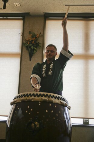 Christopher Kimmey, Mathew C. Perry Elementary School music director, performs his first Taiko drum performance during Asian Pacific Islander Heritage Month at Club Iwakuni’s Eagles Nest here May 31, 2012. DoD members playing beside Japanese civilians showed the common interest of music between these normally divergent communities.