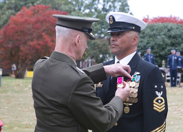 Lt. Gen Richard T. Tryon, Commander, U.S. Marine Corps Forces Command (MARFORCOM) awards Command Master Chief Michael Ruiz the Legion of Merit aboard Naval Support Activity Hampton Roads, Nov. 1. Ruiz received the award for his dedicated service to the Marine Corps while assigned to MARFORCOM.