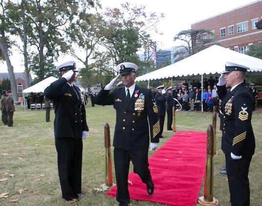 Command Master Chief Michael Ruiz walks down a ceremonial quarterdeck between Sideboys during a retirement ceremony aboard Naval Support Activity Hampton Roads, Nov. 1. Master Chief Ruiz retired on Friday after 30 years of faithful service to the U.S. Navy and Marine Corps.