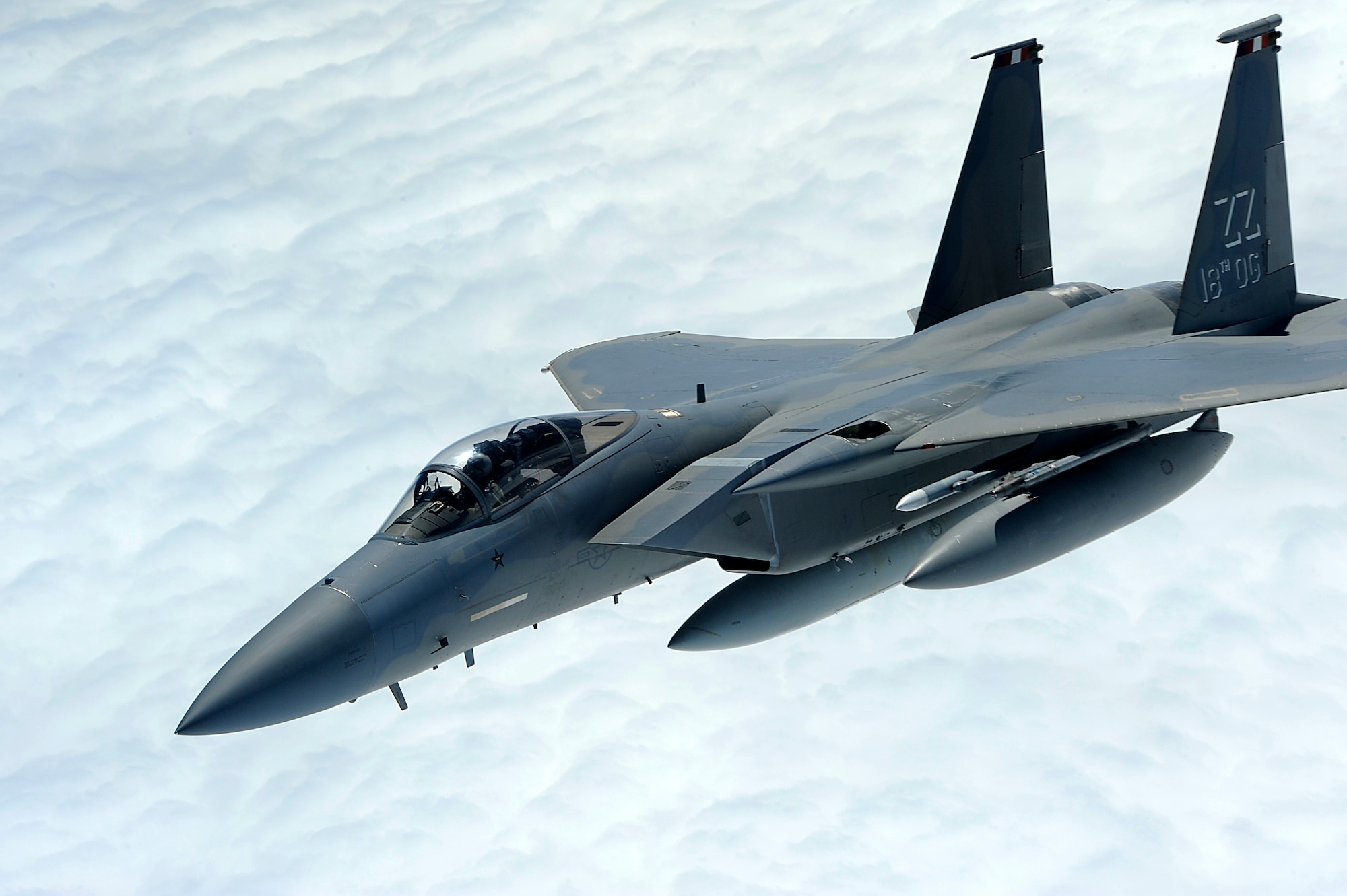 A U.S. Air Force F-15 Eagle from the 67th Fighter Squadron breaks away from a 909th Air Refueling Squadron KC-135 Stratotanker over the Pacific Ocean Oct. 28, 2013. For more than three weeks, six F-15s from the 67th FS trained with the Republic of Singapore air force to improve international cohesion and further develop allied partnerships for the security of the Asia-Pacific region. (U.S. Air Force photo by Senior Airman Maeson L. Elleman)