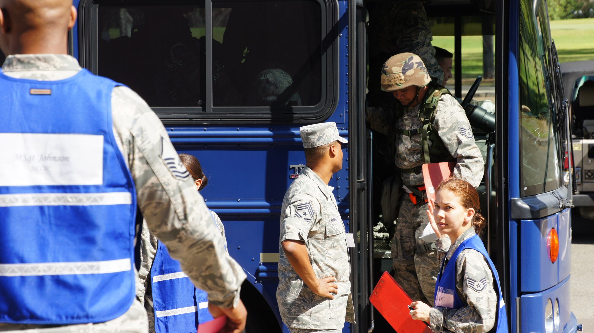 Chief Master Sgt. Leslie Bramlett, 15th Wing command chief, greets exercise deployers for the Hawaii National Guard and Active Duty Air Force as they arrive at the mobility line for an exercise deployment during a Combined Unit Inspection, Nov. 03, at Joint Base Pearl Harbor-Hickam. The CUI is the final step in over 18 months of preparation and exercises by the active duty’s 15th Wing and the Hawaii Air National Guard’s 154th Wing. The inspection allows the wings to prove their ability to deploy quickly in response to an international threat, and their operational readiness in a foreign combat scenario. (Air National Guard photo/Tech. Sgt. Andrew Jackson/Released)