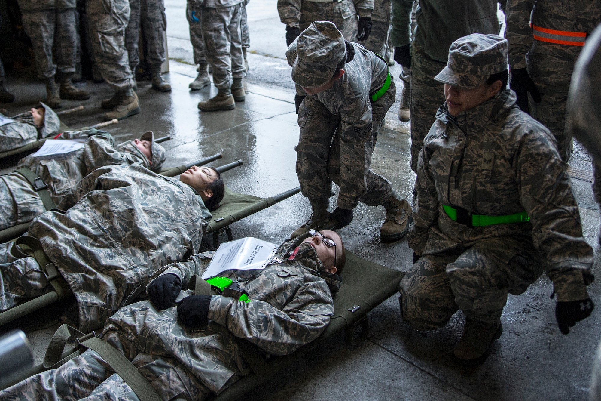 Reserve Airmen from the 446th Aeromedical Staging Squadron help treat and comfort "patients" in a triage area during the Reserve drill weekend, Nov. 2. About 130 Reserve Airmen from the 446th Aeromedical Staging Squadron at Joint Base Lewis-McChord, Wash. took part in two mass-casualty training exercises in order to remain in compliance with their readiness requirements. (U.S. Air Force Reserve photo by Master Sgt. Jake Chappelle)
