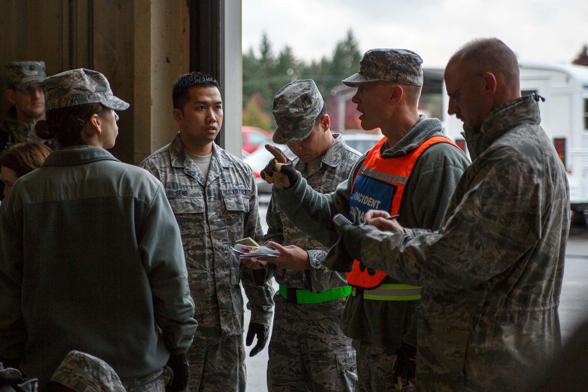 Reserve Airmen from the 446th Aeromedical Staging Squadron review their strategy in a "triage" area during the Reserve drill weekend, Nov. 2. About 130 Reserve Airmen from the 446th Aeromedical Staging Squadron at Joint Base Lewis-McChord, Wash. took part in two mass-casualty training exercises in order to remain in compliance with their readiness requirements. (U.S. Air Force Reserve photo by Master Sgt. Jake Chappelle)