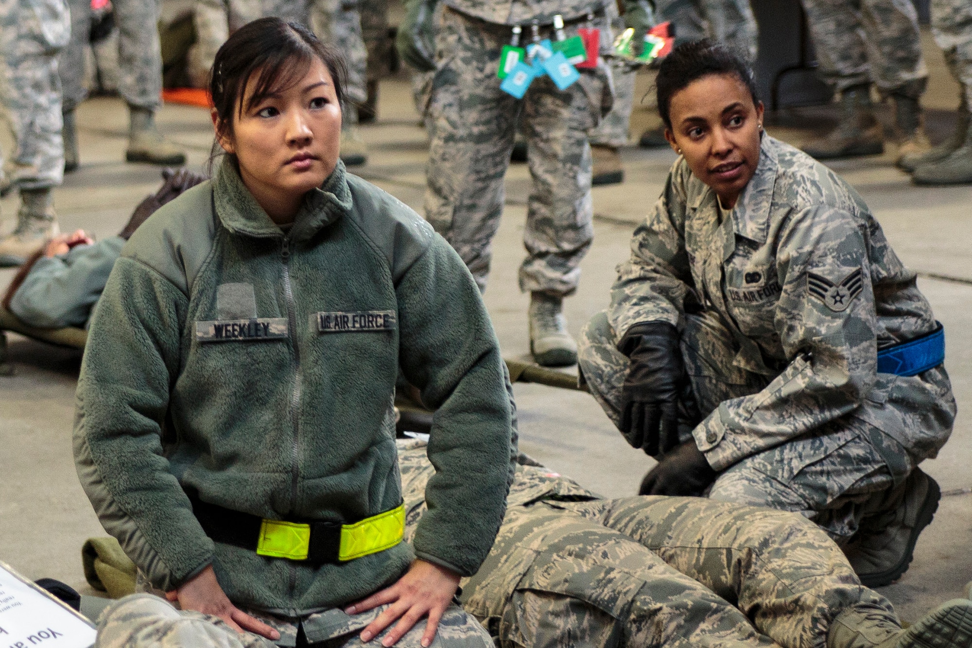 Reserve Airmen from the 446th Aeromedical Staging Squadron listen to the site commander of a "triage" area during the Reserve drill weekend, Nov. 2. About 130 Reserve Airmen from the 446th Aeromedical Staging Squadron at Joint Base Lewis-McChord, Wash. took part in two mass-casualty training exercises in order to remain in compliance with their readiness requirements. (U.S. Air Force Reserve photo by Master Sgt. Jake Chappelle)