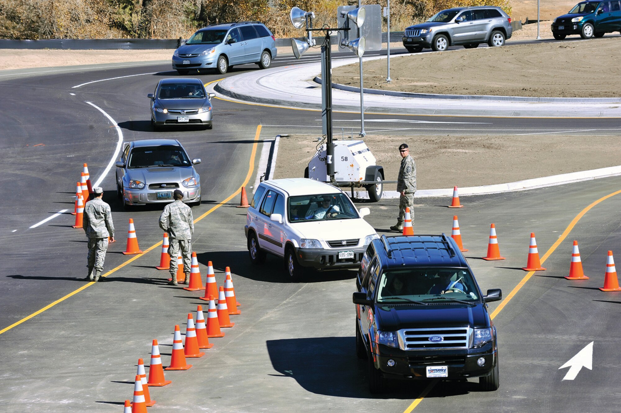 10th Security Forces Squadron Airmen keep traffic flowing toward Falcon Stadium Oct. 26.