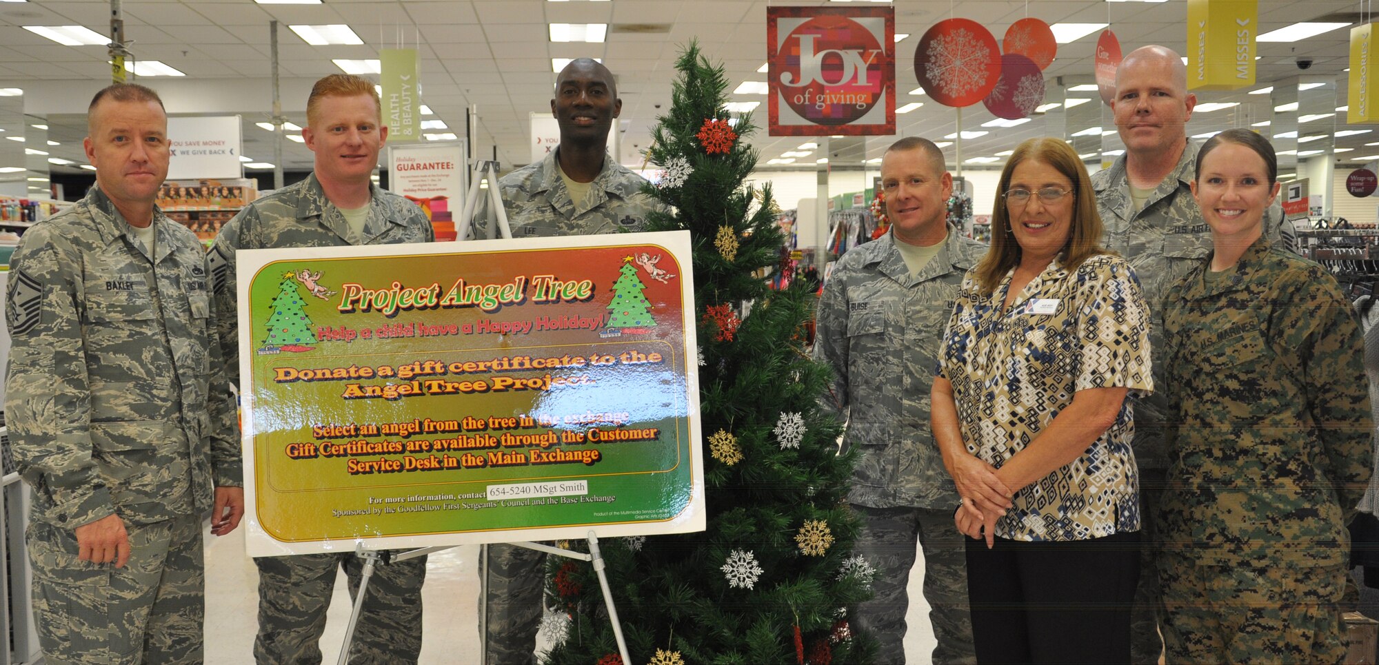 GOODFELLOW AIR FORCE BASE, Texas- Members from the Goodfellow First Sergeants’ Council and the Base Exchange pose around the Project Angel Tree Christmas tree at the Exchange Nov. 4. All proceeds from ornaments bought from the tree go to gift cards to be given to children in need during the holidays. (U.S. Air Force photo/ Airman 1st Class Erica Rodriguez) 