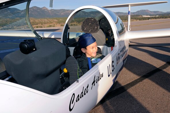 Aidan Peters, the Academy's latest Cadet for a Day, sit behind the controls of a TG-16A Glider on the Academy Airfield Oct. 25. 