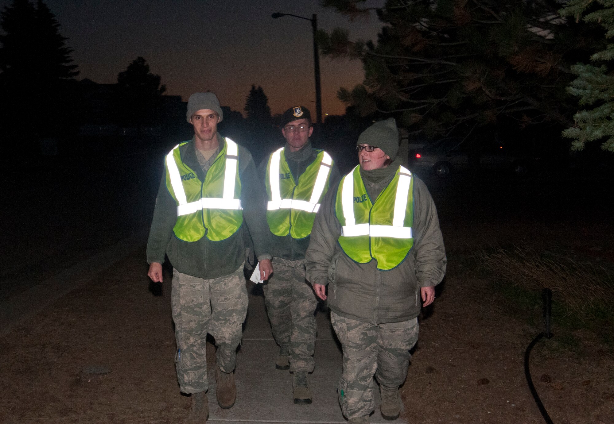 Senior Airman Matthew Garcia, Airman 1st Class Sebastian Landivar and Senior Airmen Christabelle Hawkins, 790th Missile Security Forces Squadron defenders, patrol a section of Atlas Housing, F.E. Warren Air Force Base, Wyo., on Halloween, 2013, as part of the Pumpkin Patrol. The Pumpkin Patrol is a volunteer 90th Security Forces Group effort to keep kids safe while trick-or-treating. (U.S. Air Force photo by Airman 1st Class Jason Wiese)