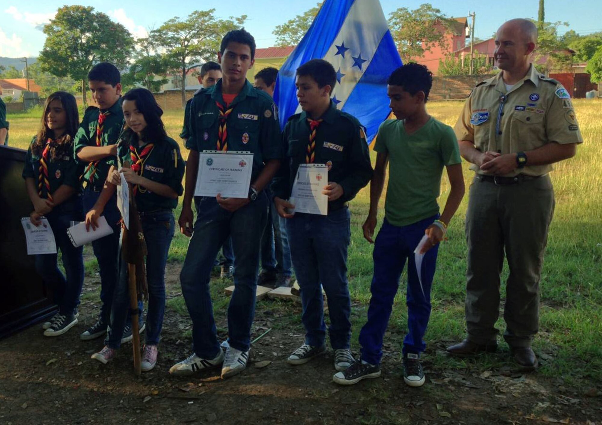 Members of the Association of Scouts of Honduras receive their first-aid merit badge during a ceremony in Comayagua, Honduras, Nov. 2, 2013.  Members of JTF-Bravo's MEDEL volunteered their spare time to train with the Honduran Scouts to assist them in earning the first-aid merit badge.  The first-aid badge was the first of its kind to be awarded to any group of Scouts in Central America.  (Photo by U.S. Army Sgt. Courtney Kreft)