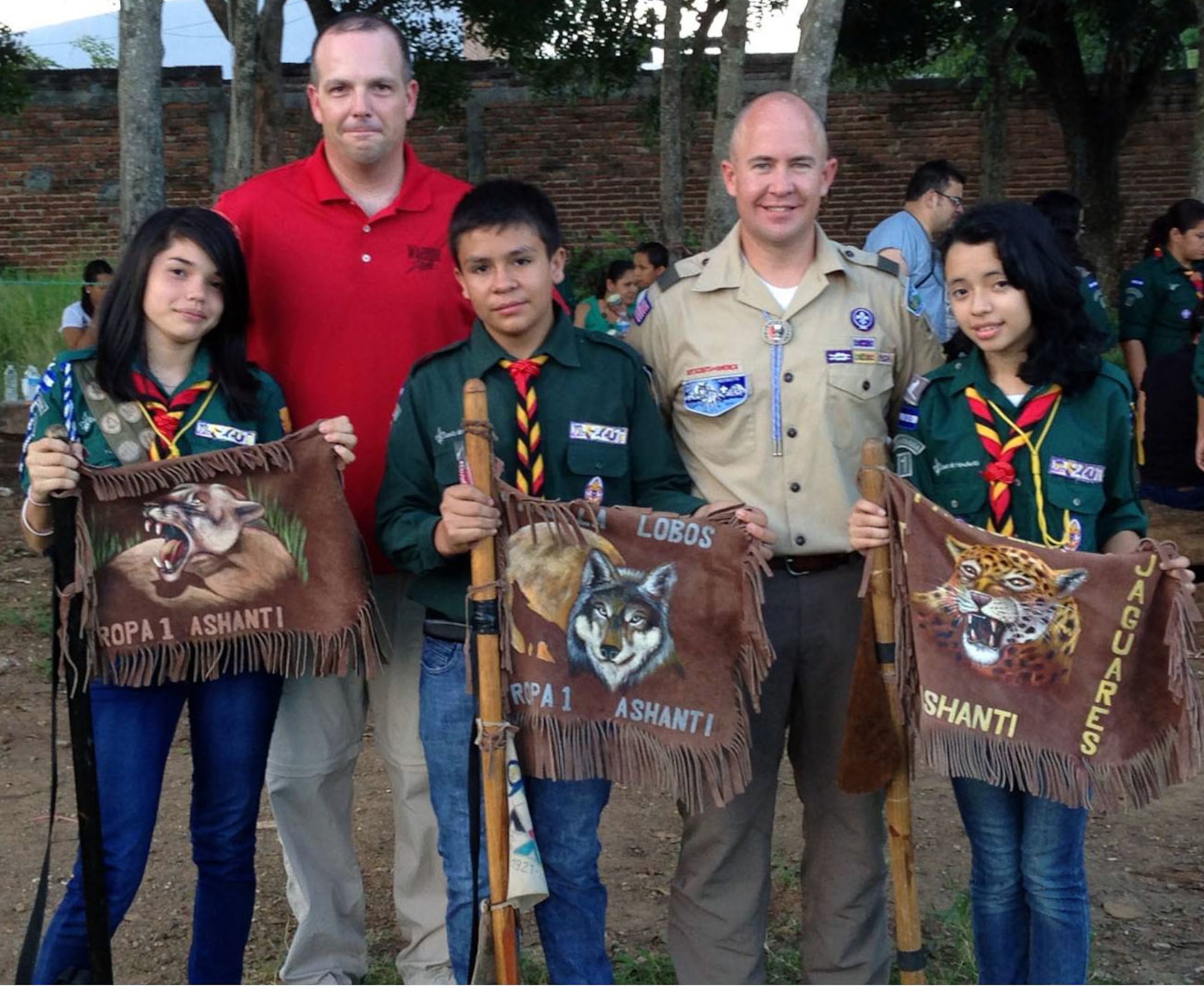 U.S. Army Staff Sgt. Chris Havermale and U.S. Army Capt. Chris Parker, both of Joint Task Force-Bravo's Medical Element (MEDEL), pose with members of the Association of Scouts of Honduras following a merit badge ceremony in Comayagua, Honduras, Nov. 2, 2013.  Members of JTF-Bravo's MEDEL volunteered their spare time to train with the Honduran Scouts to assist them in earning the first-aid merit badge.  The first-aid badge was the first of its kind to be awarded to any group of Scouts in Central America.  (Photo by U.S. Army Sgt. Courtney Kreft)