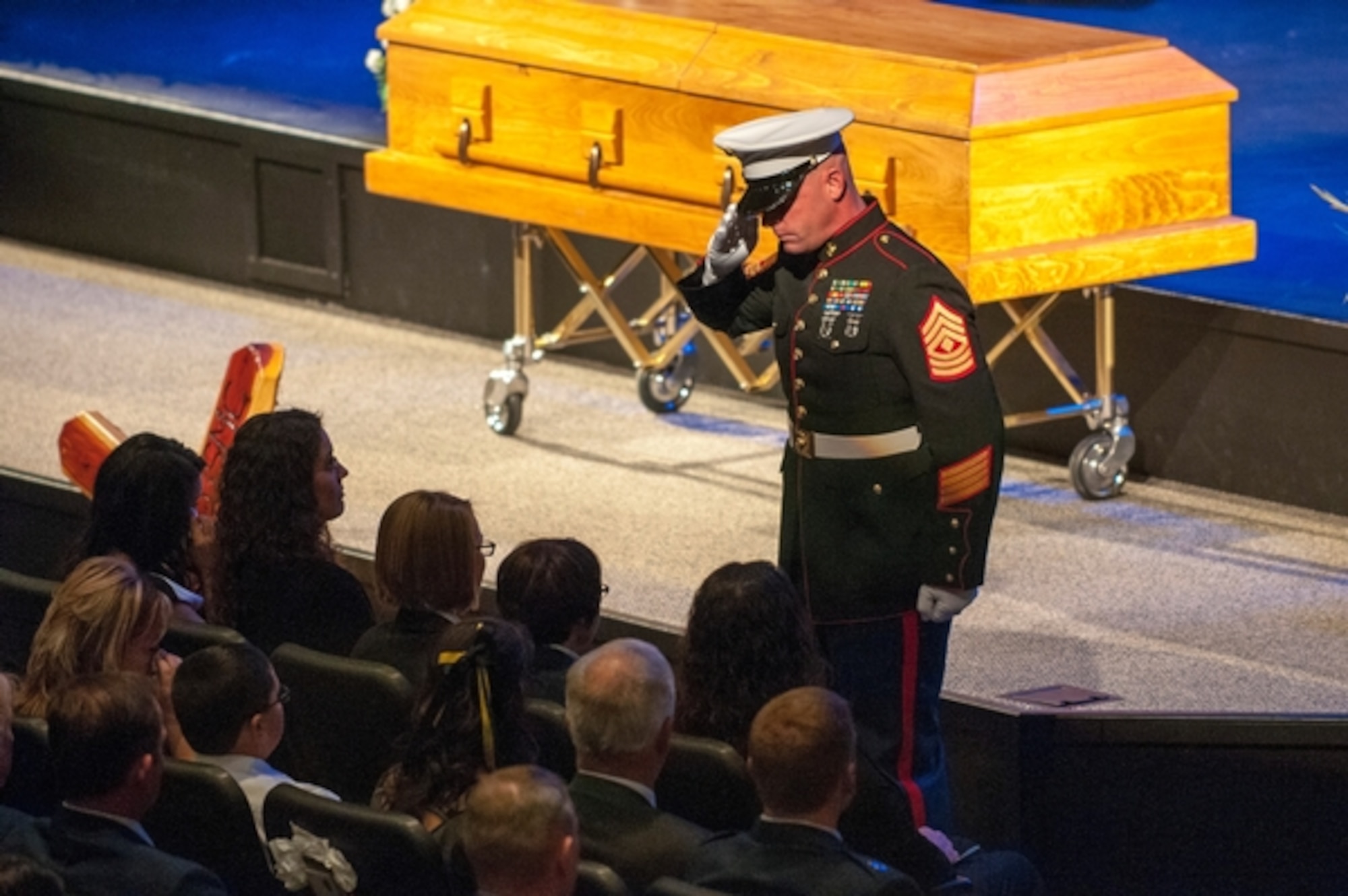 A Marine salutes the family of Marine veteran and Nevada Guard Airman Master Sgt. Michael Landsberry during a memorial service held at Sparks Christian Fellowship church Sunday. Landsberry was killed Oct. 21 during a school shooting at Sparks Middle School.  Photo by Spc. James Pierce, 106th Public Affairs Detachment