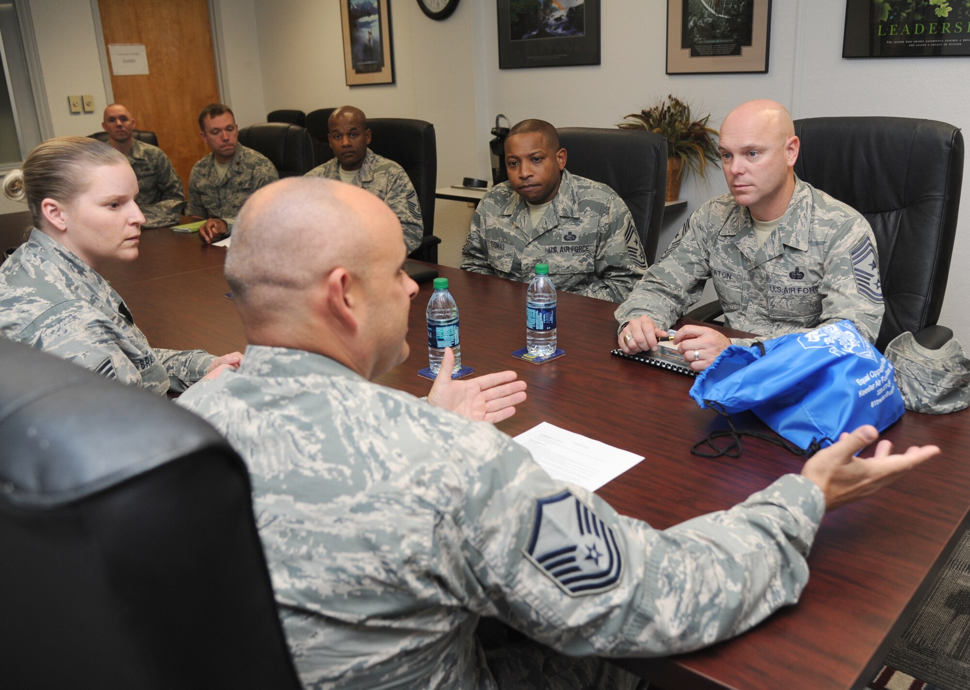 U.S. Air Force Master Sgt. Shane Sullivan, 81st Force Support Squadron, briefs the duties of the equal opportunity office to Chief Master Sgts. David Staton, 2nd Air Force command chief, and Farrell Thomas, 81st Training Wing command chief, during an immersion tour Nov. 1, 2013, at the Professional Development Center, Keesler Air Force Base, Miss.  The purpose of the tour was for Staton and Thomas to become familiar with the base mission, operations and personnel. (U.S. Air Force photo by Kemberly Groue)