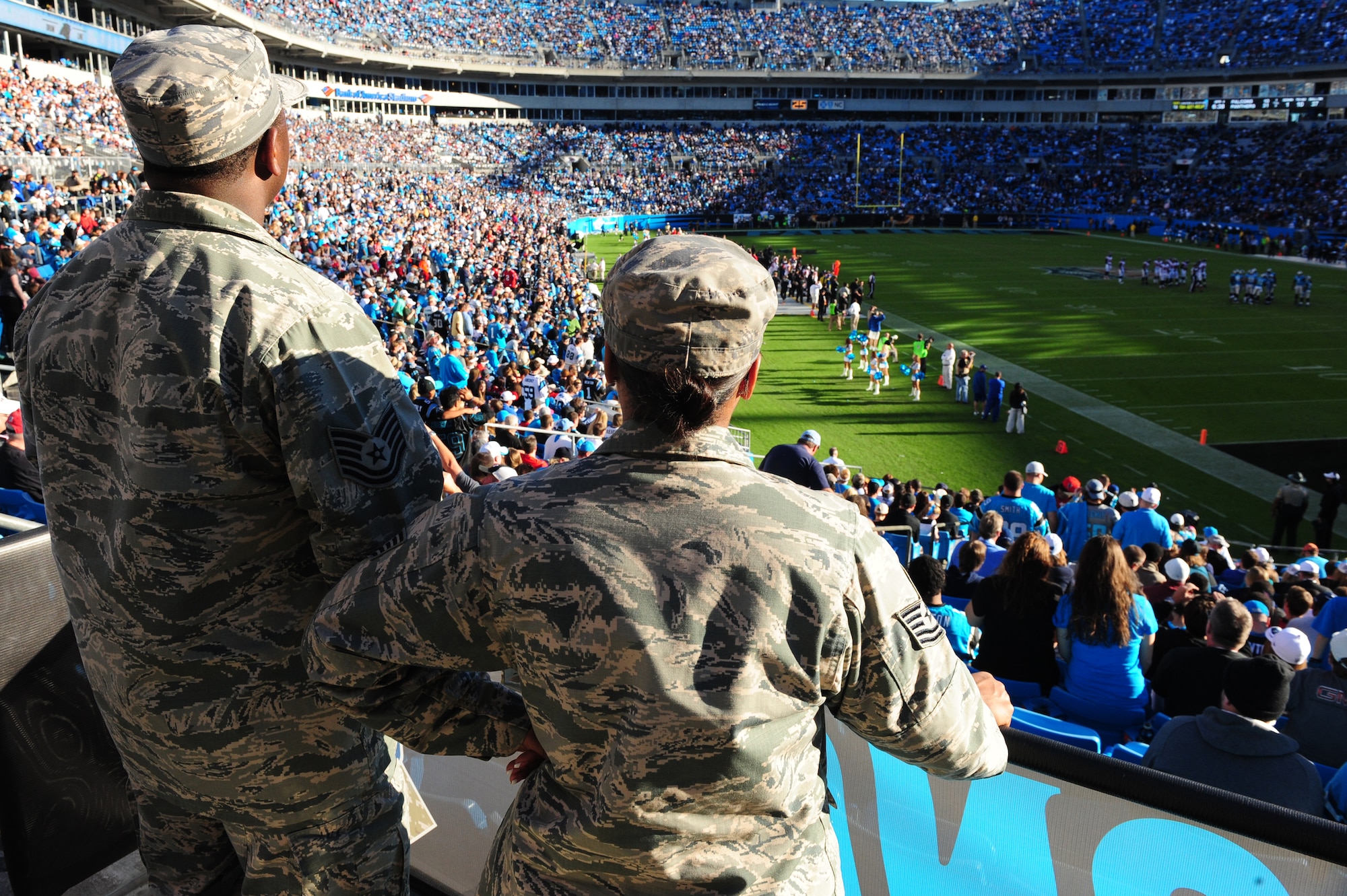 Tech. Sgts. Librian Stephens, 4th Maintenance Group leading standardization section team member, and his wife Lanika Stephens, 4th Aircraft Maintenance Squadron weapons standardization specialist, watch a Carolina Panthers game from “Row of Honor” seats at Bank of America Stadium in Charlotte, N.C., Nov. 3, 2013. The military honorees were given sideline access during the pregame and a special presentation prior to kick-off. (U.S. Air Force photo by Airman 1st Class Brittain Crolley)