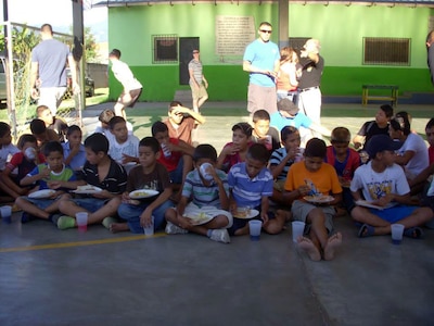 Members of Joint Task Force-Bravo's Army Forces (ARFOR) Battalion paid a visit to the children of the Horizontes al Futuro orphanage in Comayagua, Honduras, Nov. 3, 2013.  The ARFOR members brought sandwiches, chips and drinks for the children for lunch, and spent the day playing games and visiting with the kids.  (U.S. Air Force photo by Master Sgt. Terry LaBreck)