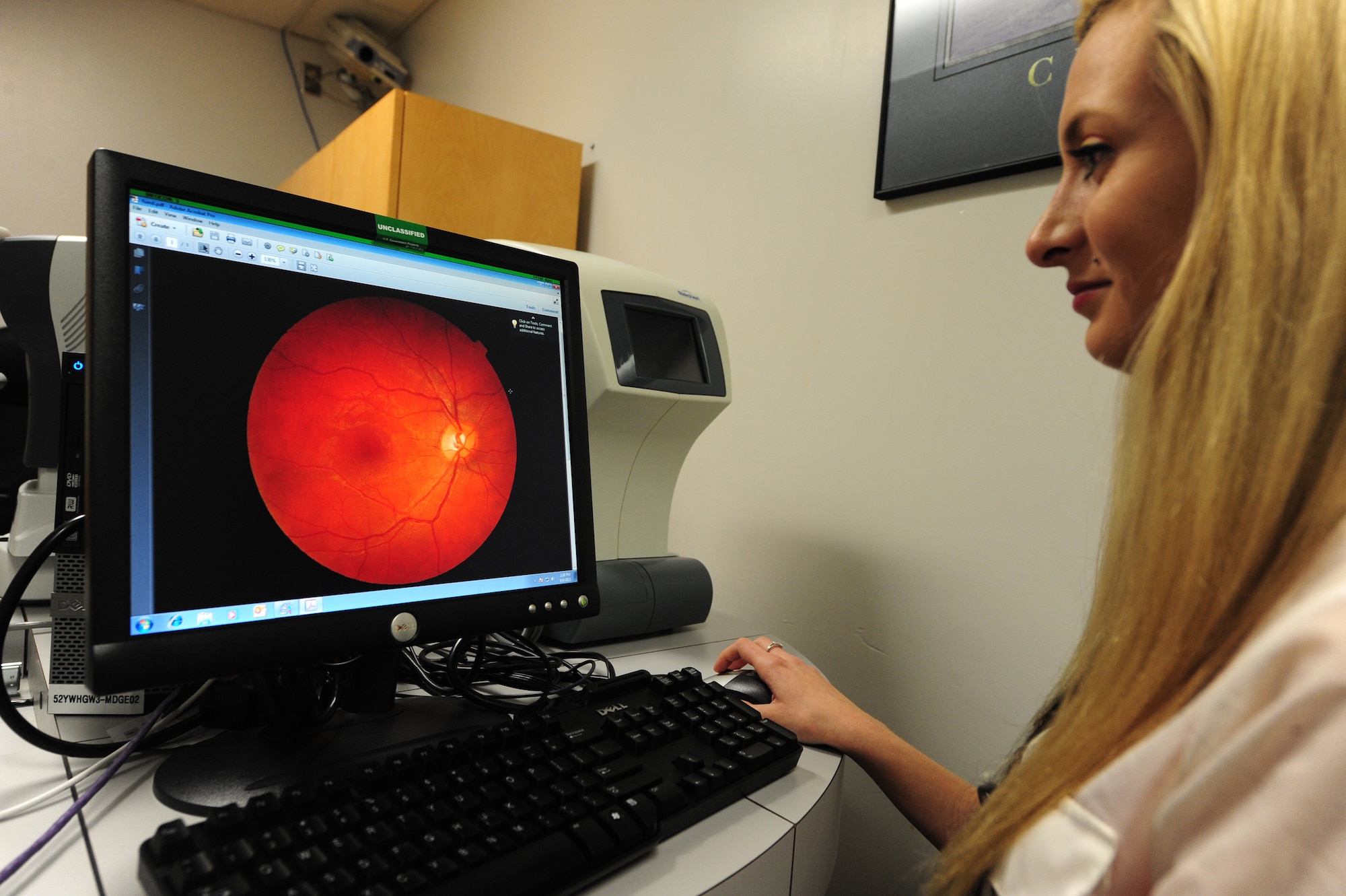 Alyssa White, 509th Medical Operations Squadron optometry technician, captures a picture of a patient’s retina in the optometry clinic at Whiteman Air Force Base, Mo., Sept. 4, 2013. The picture provides information that the optometrist uses to detect ocular disease. (U.S. Air Force photo by Staff Sgt. Nick Wilson/Released)