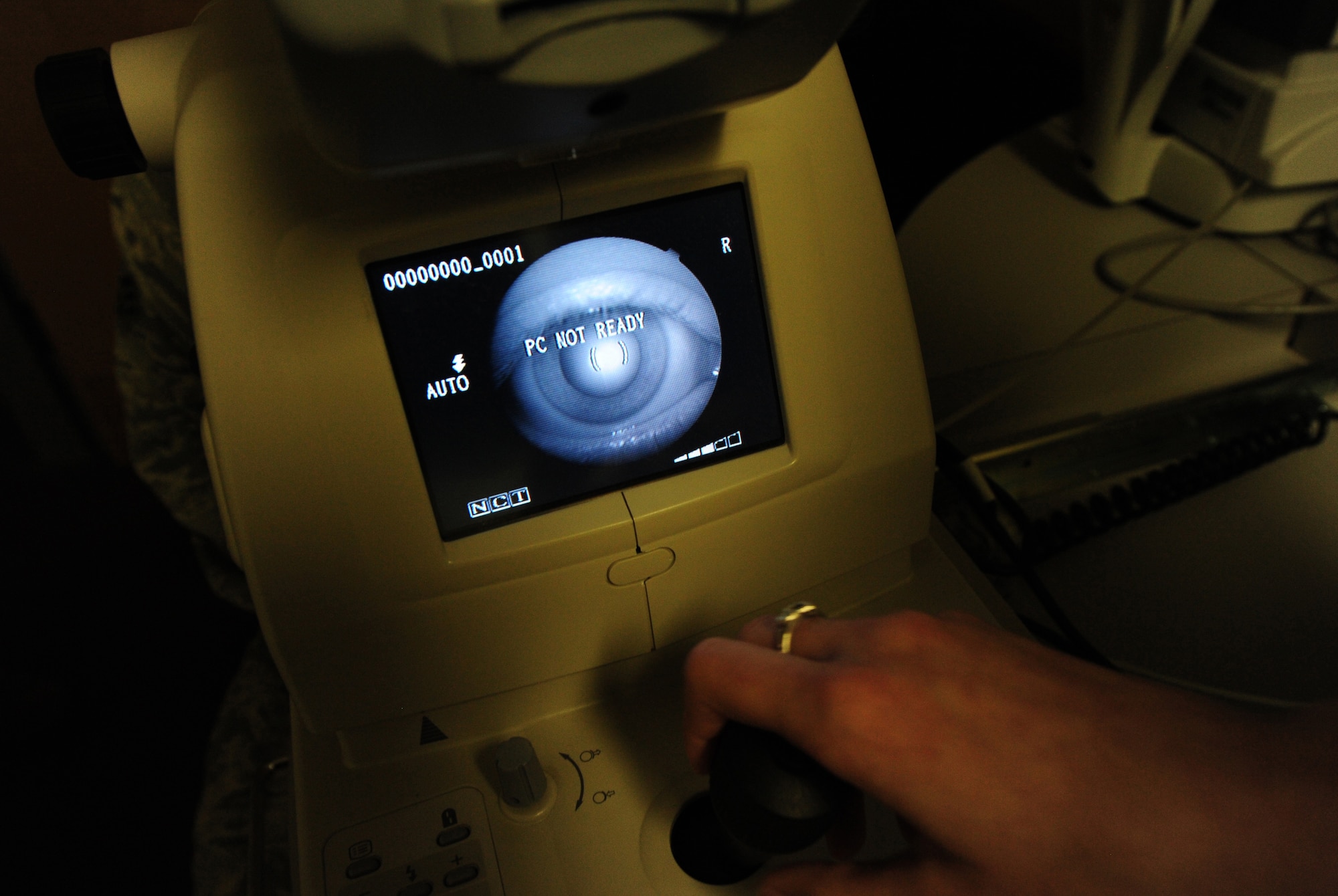 Alyssa White, 509th Medical Operations Squadron optometry technician, uses an orb scan to evaluate a patient’s eye in the optometry clinic at Whiteman Air Force Base, Mo., Sept. 4, 2013. The orb scan shows the curvature, structure, integrity and thickness of a patient’s cornea. (U.S. Air Force photo by Staff Sgt. Nick Wilson/Released)