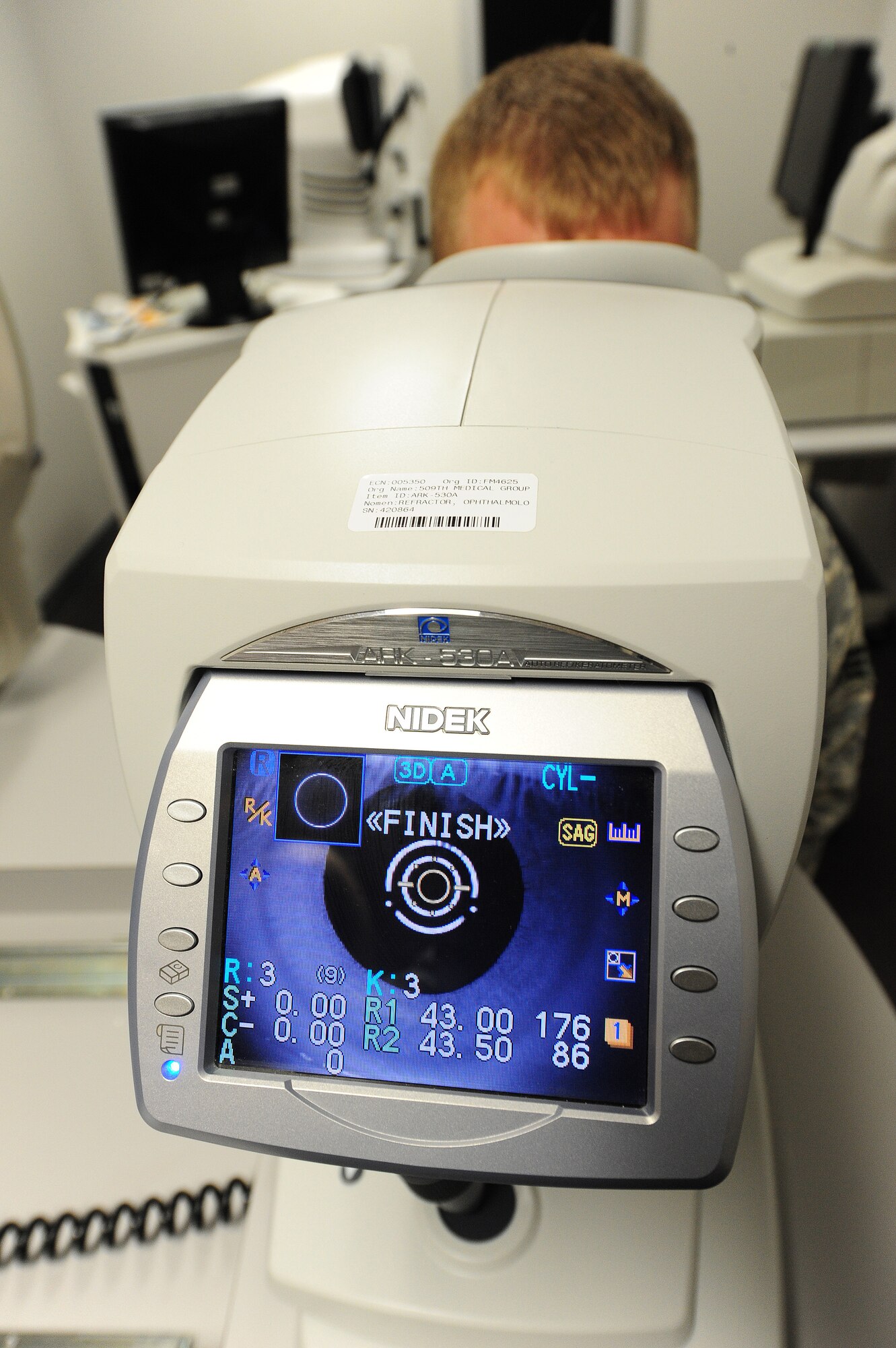 An auto refection instrument is used to evaluate a patient’s eyes in the optometry clinic at Whiteman Air Force Base, Mo., Sept. 4, 2013. This device is used to measure the curvature of the cornea and acquire an estimated prescription that the optometrist uses during the exam.  (U.S. Air Force photo by Staff Sgt. Nick Wilson/Released)