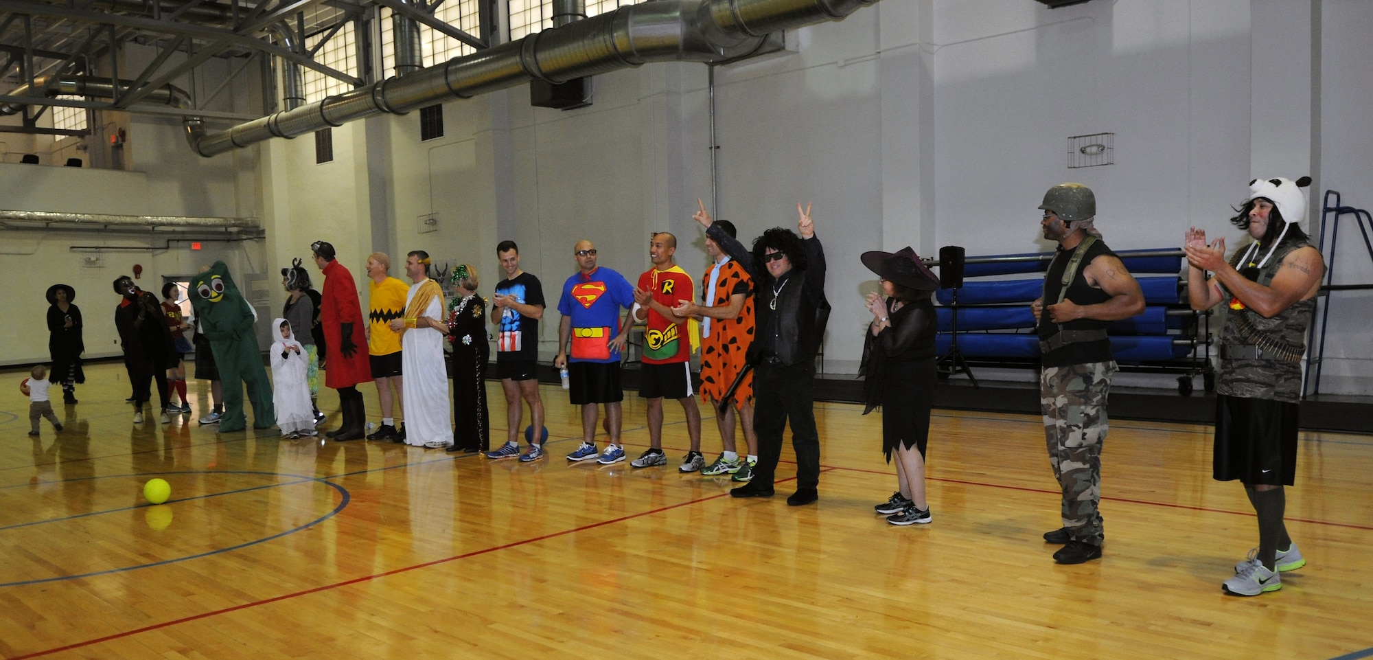 Air Force Legal Operations Agency airmen celebrate the announcement of the costume contest winners during Wingman Costume Dodge Ball at the East Fitness Center on Joint Base Andrews, Md., Oct. 31, 2013.  AFLOA hosted the tournament to celebrate Halloween while boosting morale. (U.S. Air Force photo/ Airman 1st Class Nesha Humes)