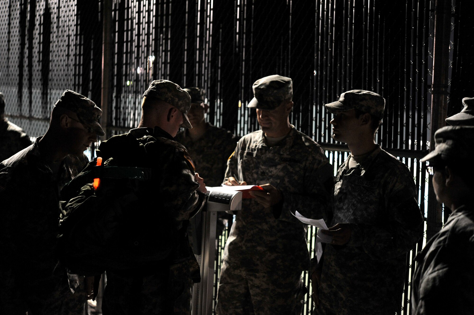 GOODFELLOW AIR FORCE BASE, Texas-- Soldiers from the Army 344th Military Intelligence Battalion weigh their ruck sacks before participating in the Iron Soldier Competition Oct. 26. The competition is made up of teams of four soldiers who race against time to complete grueling physical and mental tasks. (U.S. Air Force photo/ Senior Airman Michael Smith)