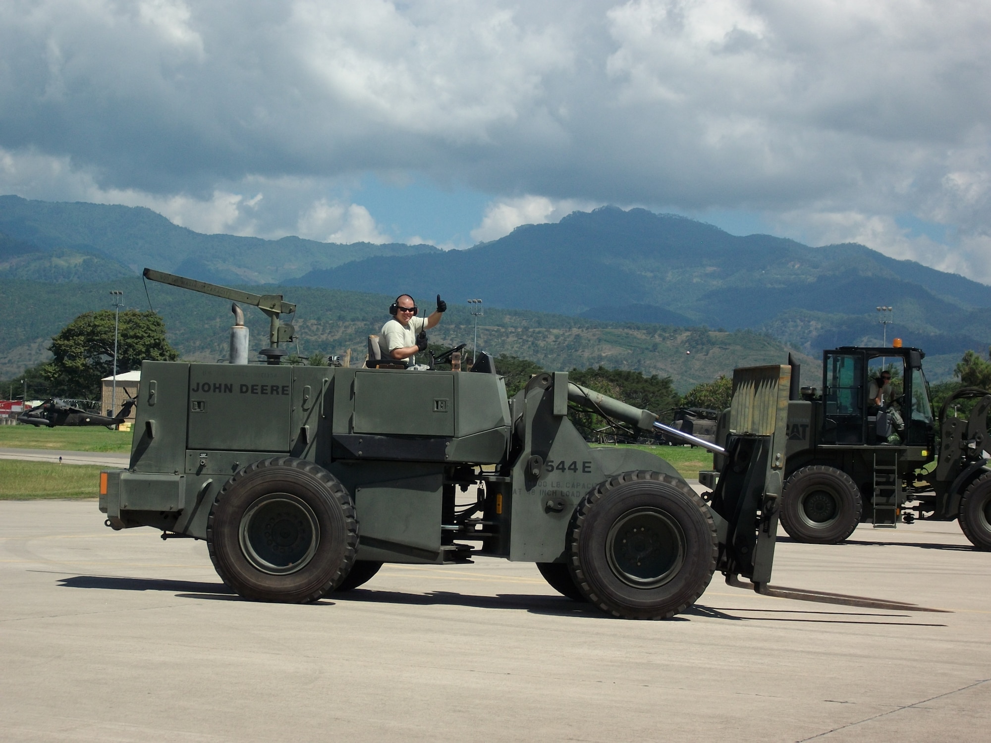 Members of Joint Task Force-Bravo's 612th Air Base Squadron offload cargo from a C-17 Globmaster III aircraft from Charletson Air Force Base, S.C, on the flightline at Soto Cano Air Base, Honduras, Nov. 3, 2013.  The 612 ABS provides a day and night, all-weather, C-5 capable airfield, base operations support, air traffic control, weather, crash and fire rescue, logistics and base civil engineers to support theater-wide USSOUTHCOM operations. (U.S. Air Force photo by Tech. Sgt. Stacy Rogers)