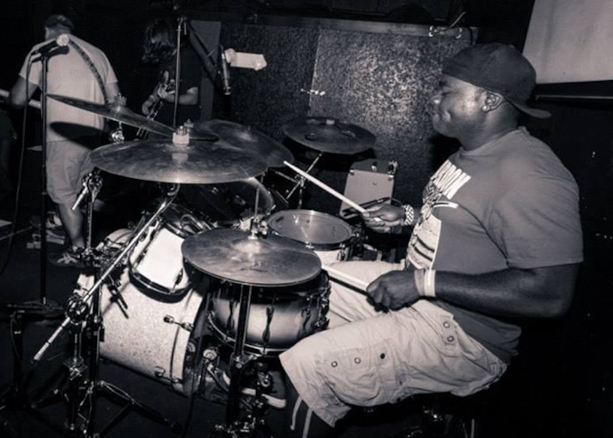 Tech. Sgt. Jacoby Jackson plays drums for The New Earth Army band during a show in Tallahassee, Fla. on Oct. 3. He manages time to jam in between performing his unique Air Force mission at the 36th Electronic Warfare Squadron as an NCO in charge of infared countermeasures. The six-member band is known in the Northwest Florida music industry for a sound that pulls influences from rock, blues, funk, jazz and world music. (Courtesy photo/H&S Studio)