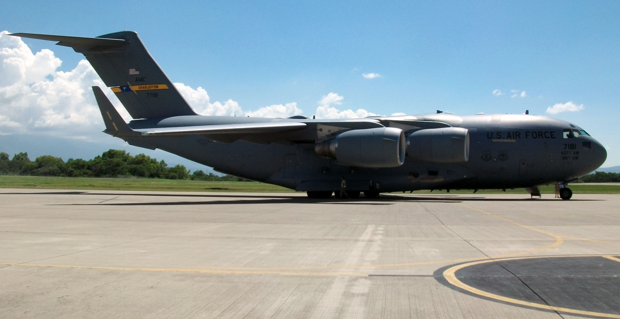 A C-17 Globemaster III from Charleston Air Force Base, S.C., sits on the flightline at Soto Cano Air Base, Honduras as members of Joint Task Force-Bravo's 612th Air Base Squadron offload cargo, Nov. 3, 2013.  The C-17 is the newest and most flexible cargo aircraft in the airlift force.  The C-17 is capable of rapid strategic delivery of troops and all types of cargo to main operating bases or directly to forward bases in the deployment area.  (U.S. Air Force photo by Tech. Sgt. Stacy Rogers)