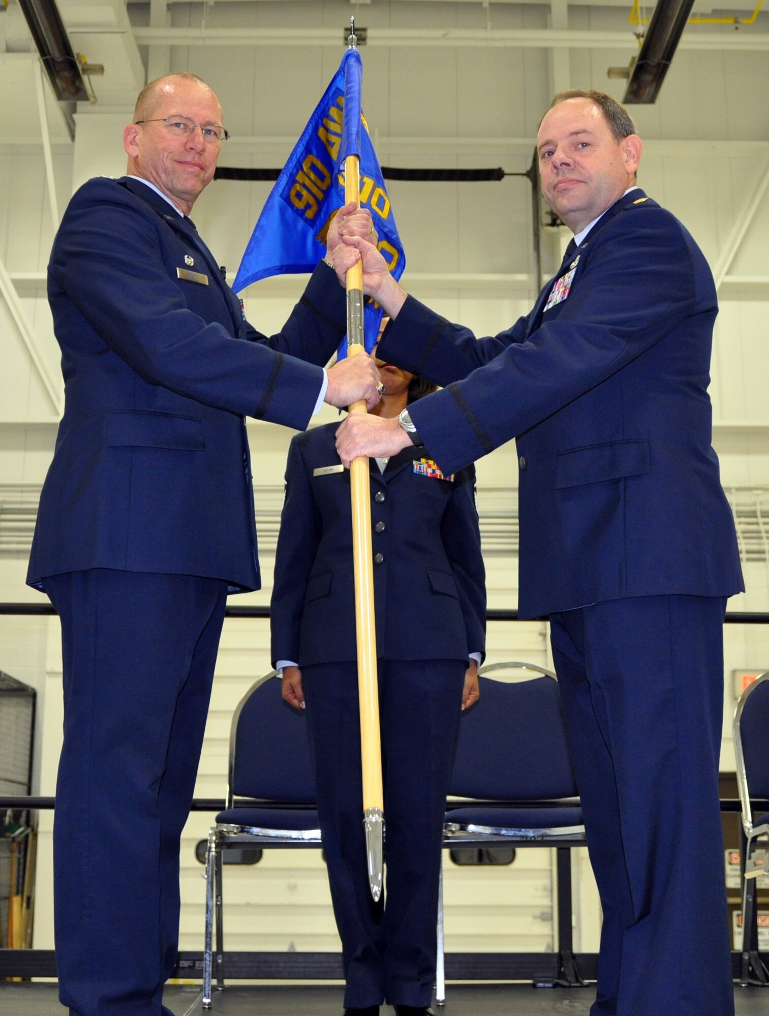 YOUNGSTOWN AIR RESERVE STATION, Ohio—U.S. Air Force Reserve Maj. Bradley Forrider, 910th Maintenance Operations Flight (MOF) Commander, relinquishes command of the MOF to Col. David Post, 910th Maintenance Group Commander (MXG), here, Nov. 2, 2013. The MOF was deactivated and will now fall under the MXG command. (U.S. Air Force photo by Tech. Sgt. Valerie Smock)