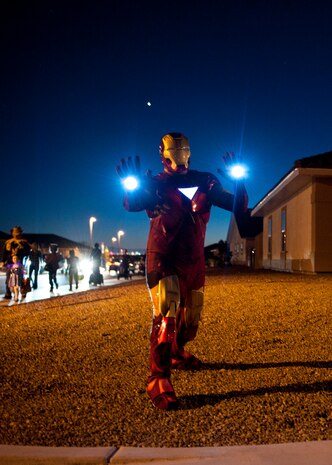 A man celebrates Halloween dressed as Iron Man in a base housing neighborhood Oct. 31, 2013, at Nellis Air Force Base, Nev. Some adults joined in the Halloween festivities and donned costumes as well. (U.S. Air Force photo by Airman 1st Class Thomas Spangler)