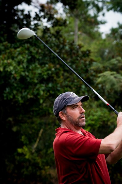 Retired U.S. Air Force Master Sgt. Mark Hart completes a tee shot during the 2013 Retiree Appreciation Week Golf Tournament at Moody Air Force Base, Ga., Nov. 1, 2013. After the tournament, golfers gathered for steaks, drinks and other refreshments. (U.S. Air Force photo by Staff Sgt. Jamal D. Sutter/Released) 