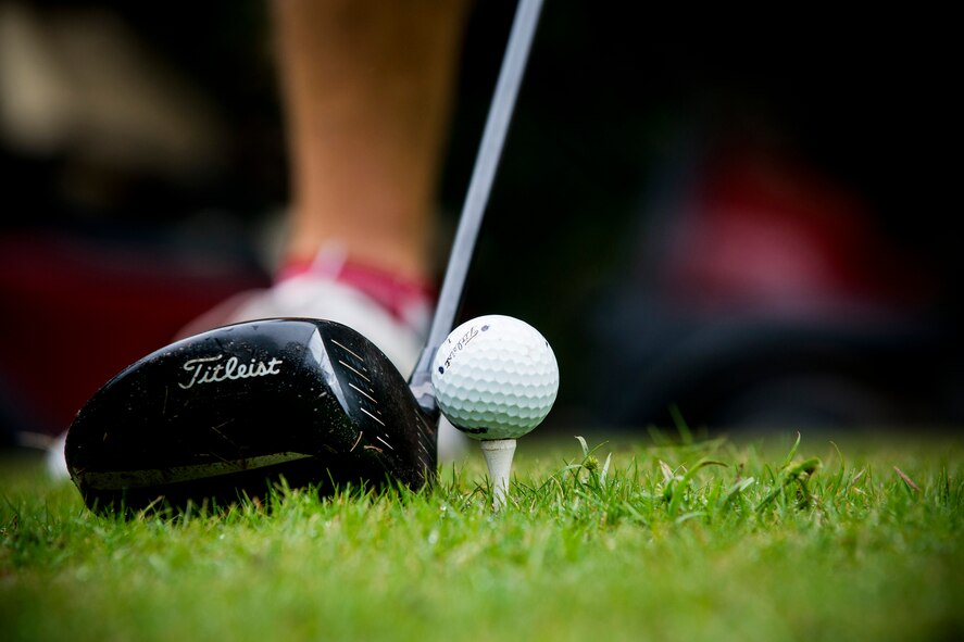 A golf player prepares for a tee shot during the 2013 Retiree Appreciation Week Golf Tournament at Moody Air Force Base, Ga., Nov. 1, 2013. The annual tournament serves as a way for the retiree, active-duty and local community to come together for a day of golf entertainment and bragging rights. (U.S. Air Force photo by Staff Sgt. Jamal D. Sutter/Released)