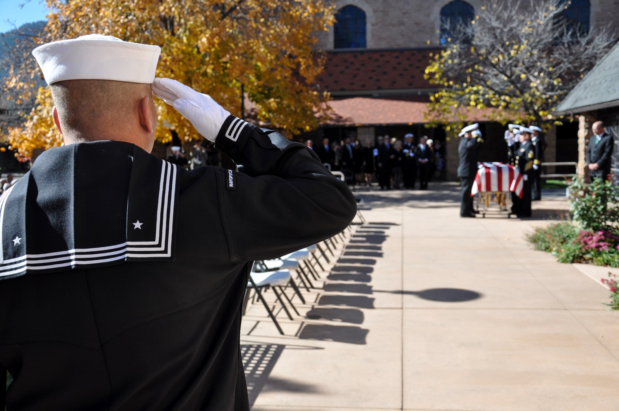 A U.S. Navy Sailor renders a salute during the military honors ceremony at retired Cmdr. Scott Carpenter’s funeral Nov. 2, 2013, at St. John Episcopal Church in Boulder, Colo. Carpenter was the first human ever to hold the title of astronaut and aquanaut. He was the fourth American astronaut to fly in space and the second to orbit the Earth. (U.S. Air Force photo by Staff Sgt. Lucas Morrow/Released)