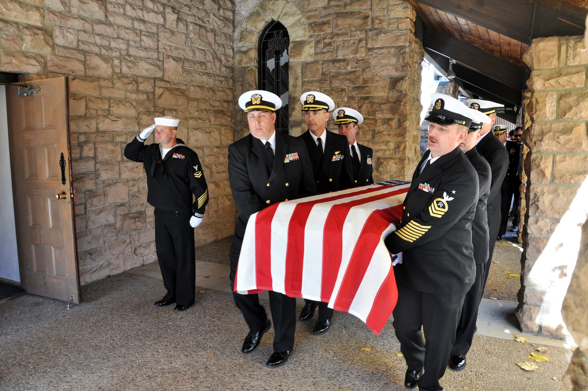 Pall bearers take the casket into the church at retired Cmdr. Scott Carpenter’s funeral Nov. 2, 2013, at St. John Episcopal Church in Boulder, Colo. Carpenter was the first human ever to hold the title of astronaut and aquanaut. He was the fourth American astronaut to fly in space and the second to orbit the Earth. (U.S. Air Force photo by Staff Sgt. Lucas Morrow/Released)