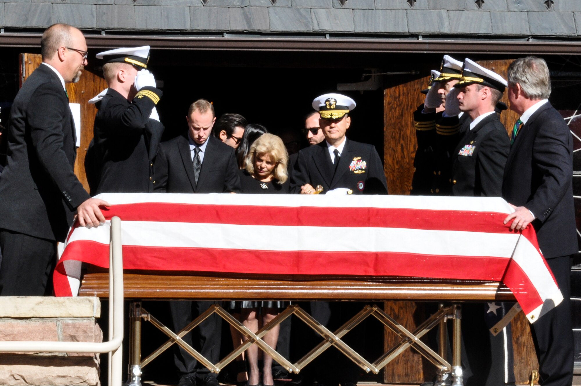 Retired Cmdr. Scott Carpenter’s family waits for the pall bearers to take the casket into the chapel for the memorial service Nov. 2, 2013, at St. John Episcopal Church in Boulder, Colo. Carpenter was the first human ever to hold the title of astronaut and aquanaut. He was the fourth American astronaut to fly in space and the second to orbit the Earth. (U.S. Air Force photo by Staff Sgt. Lucas Morrow/Released)