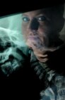 Staff Sgt Carla Hisghman, 5th Medical Support Squadron radiology technologist, views an x-ray of a human skull at Minot Air Force Base, N.D., Oct. 29, 2013. X-rays are a form of radiograph which shows the organs and bones of the human body superimposed over each other with bones appearing whiter and more solid than soft tissues. (U.S. Air Force photo/Senior Airman Stephanie Sauberan)