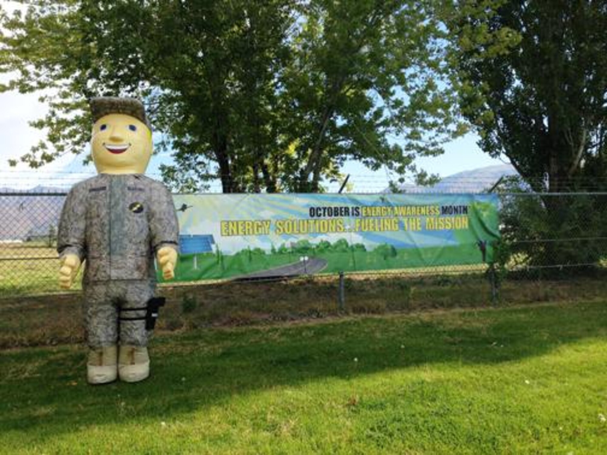 Col. Conserve, Hill AFB’s Energy Mascot, stands next to the banner announcing October as Energy Awareness Month at Hill Air Force Base, Utah. Activities were held throughout the month of October to inform Team Hill of ways to conserve energy at work and at home. (U.S. Air Force courtesy photo)