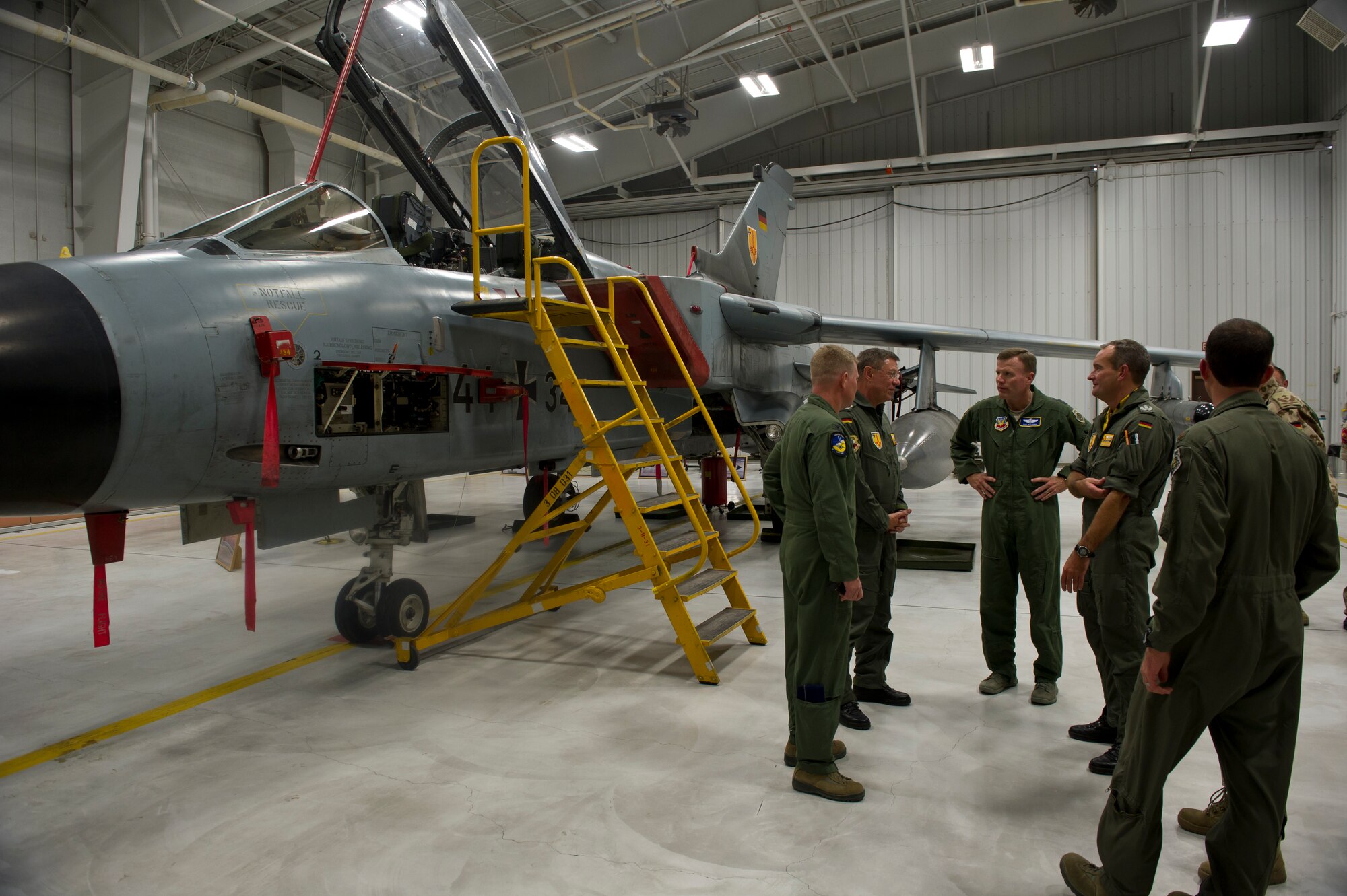 Col. Heinz Ferkinghoff, German Air Force Flying Training Center commander, guides Lt. Gen. Tod Wolters, 12th Air Force (Air Forces Southern) commander through a tour of a Tornado aircraft hangar at Holloman Air Force Base, N.M., Oct. 24. Holloman was the first base Gen. Wolters visited after assuming command at Davis-Monthan AFB, Ariz., Sept. 24. The 12th Air Force is responsible for the combat readiness of 10 active duty wings, operating more than 800 aircraft with more than 64,500 uniformed and civilian Airmen. (U.S. Air Force photo by Airman 1st Class Chase Cannon/Released)