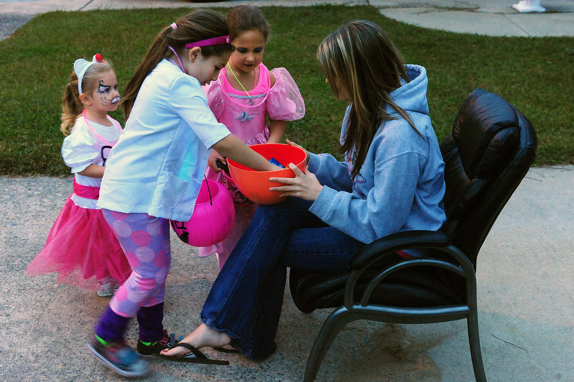 Children visit the house of U.S Air Force Airman 1st Class Ryon Matheson, 4th Security Forces Squadron defender, during trick-or-treating at Seymour Johnson Air Force Base, N.C., Oct. 31, 2013.  In the spirit of Halloween, many base housing dwellers participated in handing out candy to children.  (U.S. Air Force photo by Airman 1st Class Brittain Crolley)