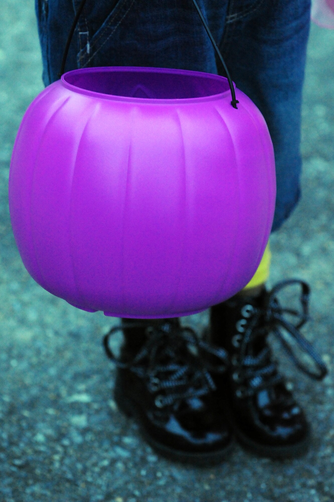 A child holds a candy bucket during trick-or-treating at Seymour Johnson Air Force Base, N.C., Oct. 31, 2013.  Members of Team Seymour celebrated Halloween by dressing up and passing out or receiving candy.  (U.S. Air Force photo by Airman 1st Class Brittain Crolley)