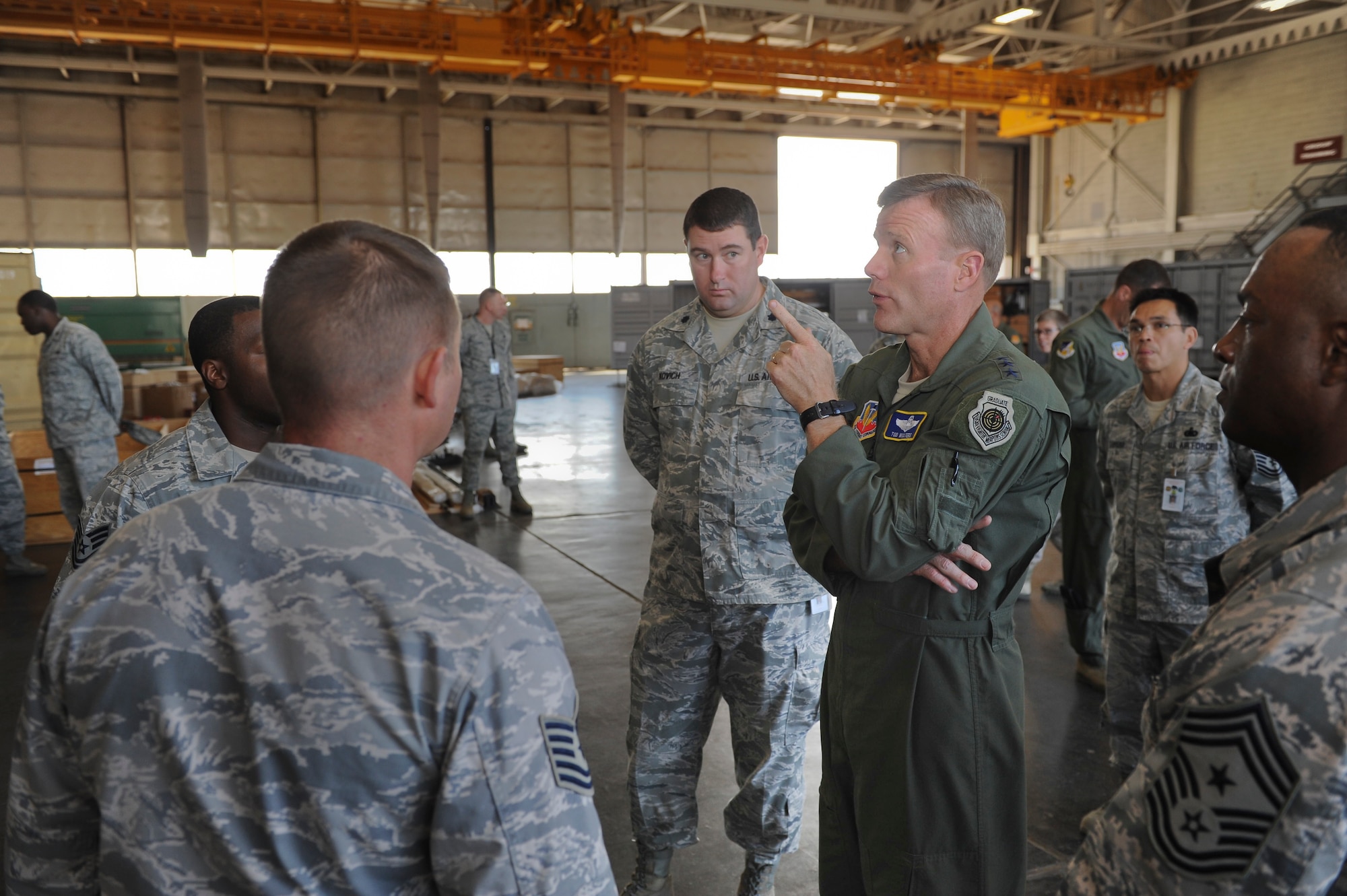 Airmen from the 49th Aircraft Maintenance Squadron describe their daily operations to Lt. Gen. Tod Wolters, 12th Air Force (Air Forces Southern) commander, and 12th Air Force Command Chief Master Sgt. Calvin Williams at Holloman Air Force Base, N.M., Oct. 24. Holloman was the first base Gen. Wolters visited after assuming command at Davis-Monthan AFB, Ariz., Sept. 24. The 12th Air Force is responsible for the combat readiness of 10 active duty wings, operating more than 800 aircraft with more than 64,500 uniformed and civilian Airmen. (U.S. Air Force photo by Airman 1st Class Colin Cates/Released)