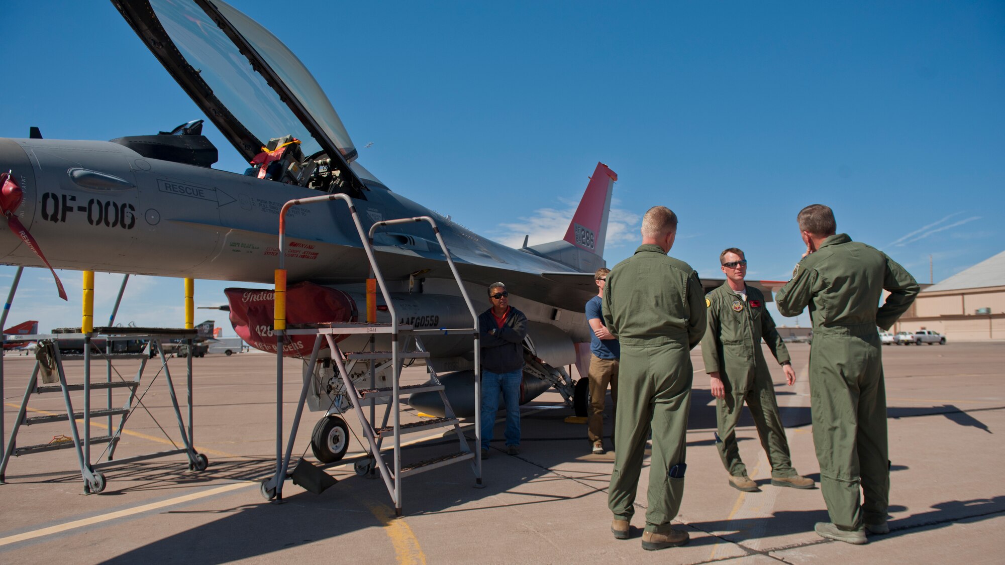 Lt. Col. Brian Swyt, 82nd Aerial Targets Squadron commander, describes the current use and function of QF-16 drones to Lt. Gen. Tod Wolters, 12th Air Force (Air Forces Southern) commander, and Col. Andrew Croft, 49th Wing commander, at Holloman Air Force Base, N.M., Oct. 24. Holloman was the first base Gen. Wolters visited after assuming command at Davis-Monthan AFB, Ariz., Sept. 24. The 12th Air Force is responsible for the combat readiness of 10 active duty wings, operating more than 800 aircraft with more than 64,500 uniformed and civilian Airmen. (U.S. Air Force photo by Airman 1st Class Aaron Montoya/Released)