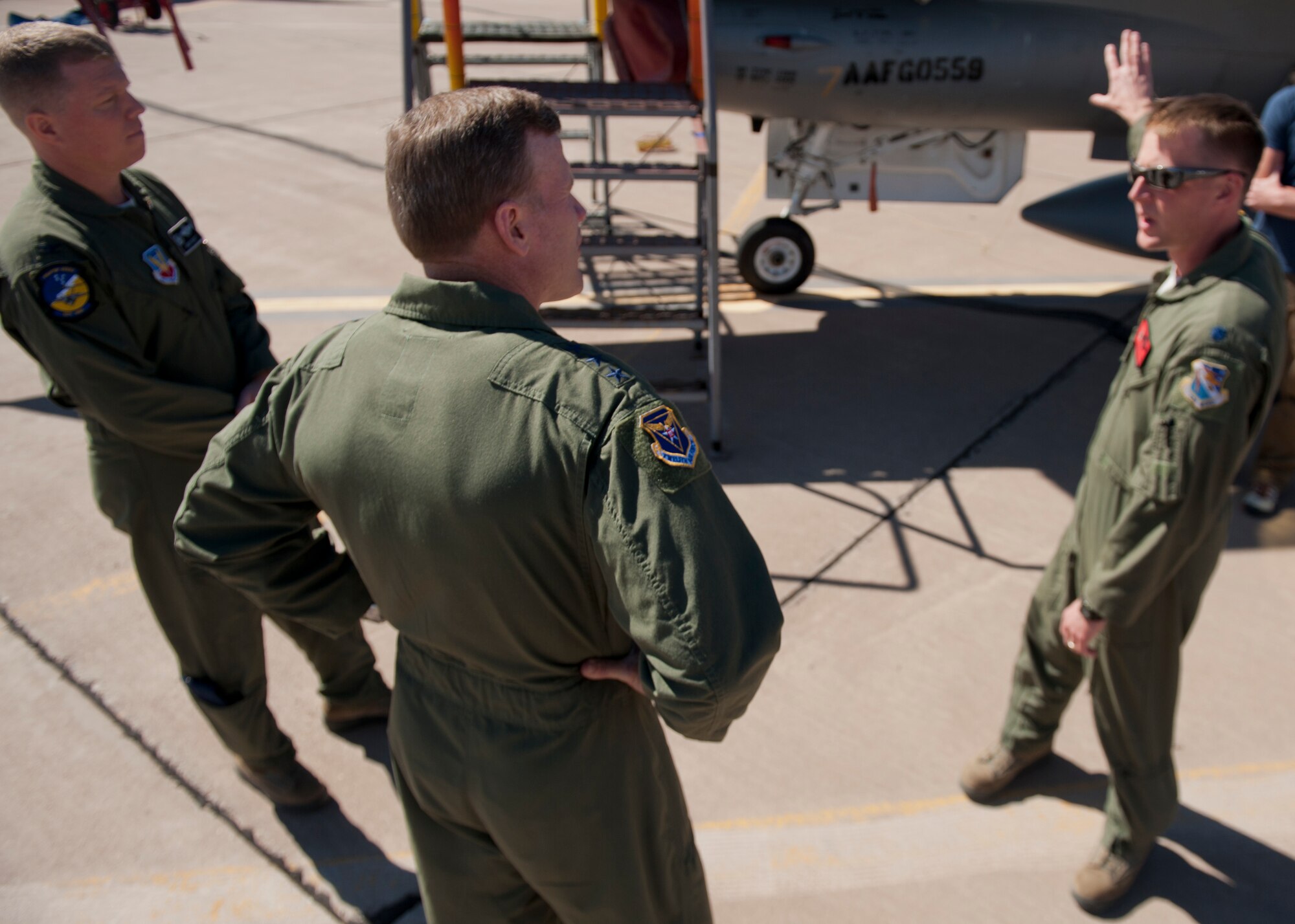 Lt. Col. Brian Swyt, 82nd Aerial Targets Squadron commander, describes the planned use and function of QF-16 drones to Lt. Gen. Tod Wolters, 12th Air Force (Air Forces Southern) commander, and Col. Andrew Croft, 49th Wing commander, at Holloman Air Force Base, N.M., Oct. 24. Holloman was the first base Gen. Wolters visited after assuming command at Davis-Monthan AFB, Ariz., Sept. 24. The 12th Air Force is responsible for the combat readiness of 10 active duty wings, operating more than 800 aircraft with more than 64,500 uniformed and civilian Airmen. (U.S. Air Force photo by Airman 1st Class Aaron Montoya/Released)